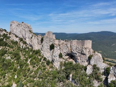 Aerial view of the Cathar castle of Peyrepertuse in the Aude region of France clipart