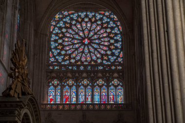 Stained glass window in the church of the diocese of Sez in Normandy, France clipart