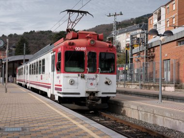 Renfe series 442 narrow gauge train, parked at the Cercedilla train station, line C-9, to Navacerrada and Cercedilla. Madrid, January 2, 2024 Spain clipart