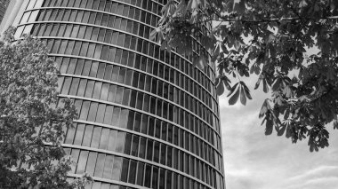 view of the PwCl Tower on Paseo de la Castellana in Madrid, in the financial complex of the 4 towers. in Spain clipart