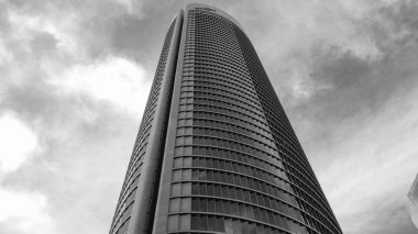 view of the PwCl Tower on Paseo de la Castellana in Madrid, in the financial complex of the 4 towers. in Spain clipart