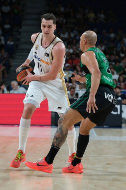Mario Hezonja  of Real Madrid during ACB Liga Endesa Basketball match between Real Madrid and Joventut Badalona at WiZink Center on April 14, 2024 in Madrid, Spain. clipart