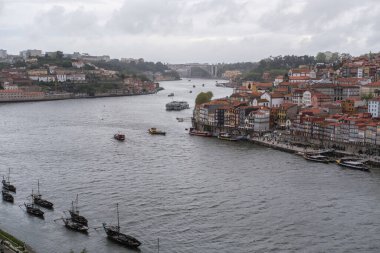 View of the Porto Riviera, stretching along thee Douro River between the cities of Porto and Vila Nova de Gaia, April 15, 2024 in Portugal. clipart