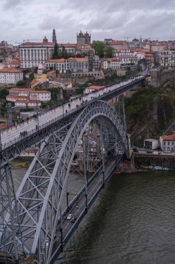 View of the Luis I Bridge, a double-deck metal arch bridge that spans the Douro River between the cities of Porto and Vila Nova de Gaia, April 15, 2024 in Portugal. clipart