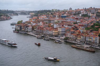 View of the Porto Riviera, stretching along thee Douro River between the cities of Porto and Vila Nova de Gaia, April 15, 2024 in Portugal. clipart