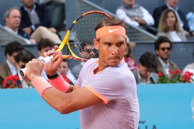 Rafael Nadal of Spain in action against Darwin Blanch on Day Three during their second round match of the Mutua Madrid Open at La Caja Magica on April 25, 2024 in Madrid, Spain clipart