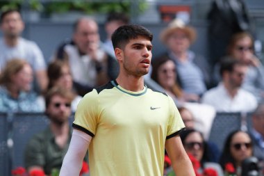 Carlos Alcaraz of Spain  against Alexander Shevchenko  during their second round match on day four of the Mutua Madrid Open at La Caja Magica on April 26, 2024 in Madrid, Spain. clipart