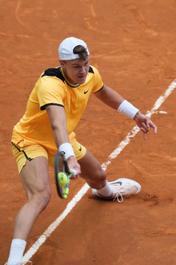 Holger Rune of Norway  against Mariano Navone  during their second round match on day four of the Mutua Madrid Open at La Caja Magica on April 26, 2024 in Madrid, Spain clipart