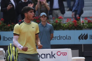 Carlos Alcaraz of Spain  against Thiago Seyboth  in the Men's Singles Round of 32 Match during Day Six of the Mutua Madrid Open at La Caja Magica on April 28, 2024 in Madrid, Spain.  clipart