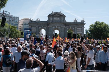 Protesters with Spanish flags during a demonstration against the amnesty law at the Puerta de Alcala, on May 26, 2024 in Madrid, Spain. clipart
