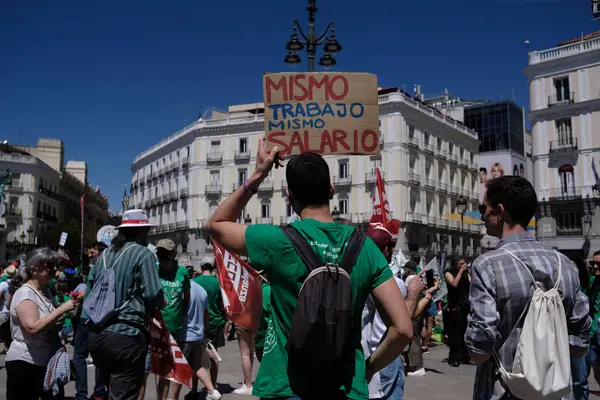 stock image Several people during a demonstration to demand the reduction of the teaching day in public education at La Puerta del Sol in Madrid, June 14, 2024, Spain