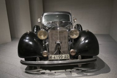 View of the exhibition of In Motion. Vehicles and carriages of National Heritage in Gallery Of The Royal Collections museum on June 28, 2023 in Madrid, Spain clipart