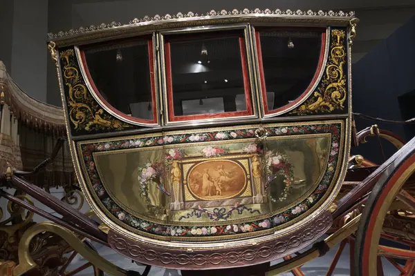 Stock image View of the exhibition of In Motion. Vehicles and carriages of National Heritage in Gallery Of The Royal Collections museum on June 28, 2023 in Madrid, Spain