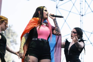 Kenzy Loevett from the group Megara performs during the concert of the Mado Pride festival in the Plaza de Espaa in Madrid, July 7, 2024 Spain clipart