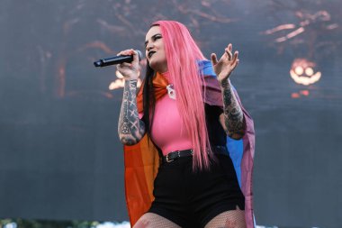 Kenzy Loevett from the group Megara performs during the concert of the Mado Pride festival in the Plaza de Espaa in Madrid, July 7, 2024 Spain clipart