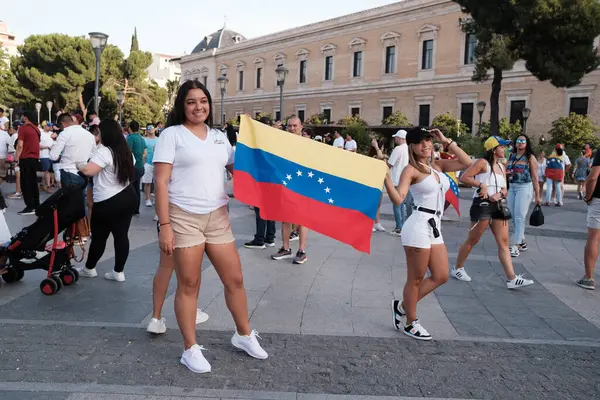 stock image Several people during the demonstration for the mobilization of hope to the caravan of freedom in the upcoming elections in Venezuela, at the Plaza de Colon on 28 July, 2024 in Madrid, Spain