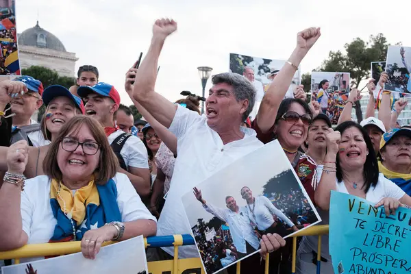 stock image Several people during the demonstration for the mobilization of hope to the caravan of freedom in the upcoming elections in Venezuela, at the Plaza de Colon on 28 July, 2024 in Madrid, Spain