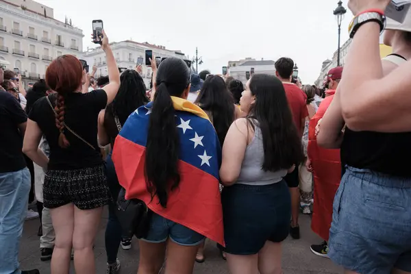 Stock image Several people during the demonstration against the results of the Venezuelan elections at sunset on July 29, 2024 in Madrid, Spain