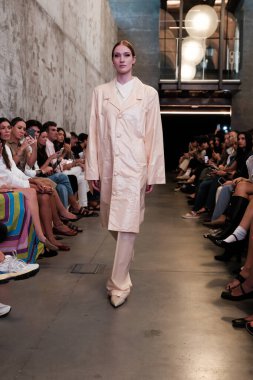 A model walks the runway wearing a design by Corsicana during Madrid Fashion Week in casa Arquitectura, September 8, 2024 Spain clipart