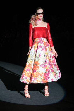 A model walks the runway wearing a design by Hannibal Laguna during Mercedes-Benz Fashion Week de Madrid in IFERMA, September 12, 2024 Spain clipart