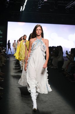 A model walks the runway wearing a design by CUSTO BARCELONA during Mercedes-Benz Fashion Week de Madrid in IFERMA, September 14, 2024 Spain clipart