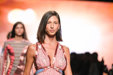 A model walks the runway wearing a design by CUSTO BARCELONA during Mercedes-Benz Fashion Week de Madrid in IFERMA, September 14, 2024 Spain clipart