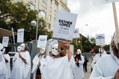 Women in white robes and masks during a demonstration to demand an end to gender-based violence in front of the Congress of Deputies in Madrid 21 September 2024 Spain clipart