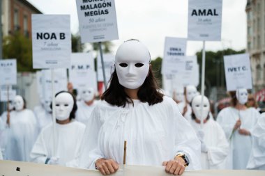 Women in white robes and masks during a demonstration to demand an end to gender-based violence in front of the Congress of Deputies in Madrid 21 September 2024 Spain clipart