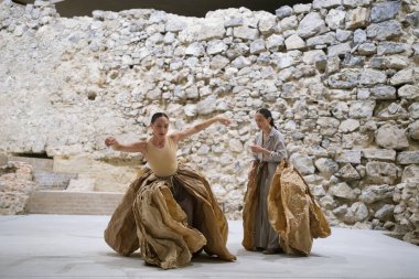 Dancers from the Chilean company Florencia Hoz perform during the performance of Antpodas in the archaeological remains room of the Royal Palace in Madrid, October 4 2024 Spain clipart