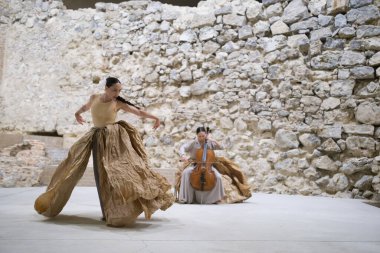 Dancers from the Chilean company Florencia Hoz perform during the performance of Antpodas in the archaeological remains room of the Royal Palace in Madrid, October 4 2024 Spain clipart