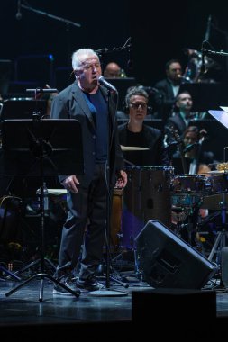 The singer-songwriter Victor Manuel during his final concert of his symphonic tour, at the Teatro Real, on November 16, 2024, in Madrid, Spain. clipart