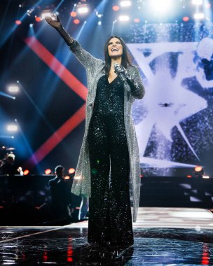 Italian singer Laura Pausini performs during her concert in Madrid, December 7, 2024 Spain clipart