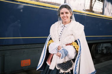 A group of people dressed in 1800 costumes from the Anacrnicos Recreacion Histrica group participate in the 100th anniversary of the Railway Museum madrid 15 December 2024 Spain clipart