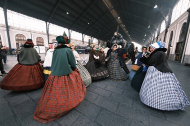 A group of people dressed in 1800 costumes from the Anacrnicos Recreacion Histrica group participate in the 100th anniversary of the Railway Museum madrid 15 December 2024 Spain clipart