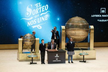 The children of San Ildefonso sing the lottery balls with the numbers of the Extraordinary Draw of the Christmas Lottery, called 'El Gordo', at the Teatro Real on December 22, 2024 in Madrid, Spain. clipart