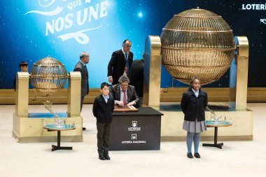 The children of San Ildefonso sing the lottery balls with the numbers of the Extraordinary Draw of the Christmas Lottery, called 'El Gordo', at the Teatro Real on December 22, 2024 in Madrid, Spain. clipart