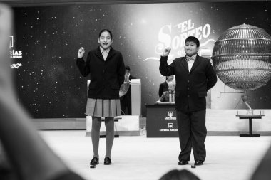 The children of San Ildefonso sing the lottery balls with the numbers of the Extraordinary Draw of the Christmas Lottery, called 'El Gordo', at the Teatro Real on December 22, 2024 in Madrid, Spain. clipart