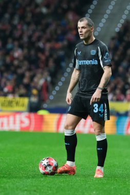  21 Ocak 2025 tarihinde İspanya 'nın Madrid kenti Bayer Leverkusen ile Atletico Madrid arasında oynanan UEFA Şampiyonlar Ligi 7. hafta futbol maçında Bayer Leverkusen' in formasını giymiştir.