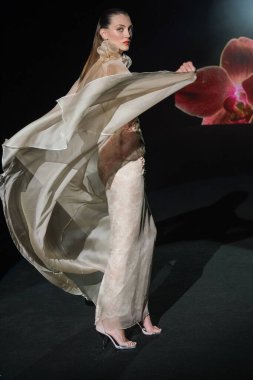 A model walks the runway wearing a design by Hannibal Laguna during Mercedes-Benz Fashion Week de Madrid in IFERMA, 21 February  2025 Spain clipart