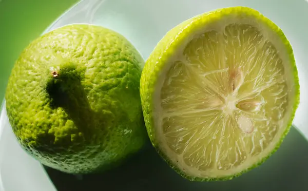 Fresh and juicy green lemon halves
