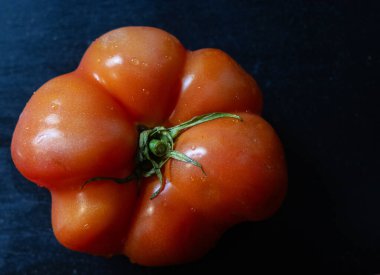 Healthy food concept Still life. Vegetables from the garden. Tomato with water drops.Used for recipe magazines and vegetarian food promotions. clipart