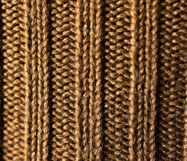 Mocha renkli örgü kumaş dokusu. Yakın çekim, kahverengi tonlarda elle örülmüş. Grafik duvar kağıdı için desenli arka plan konsepti. Gerçek yatay resim. Boşluğu kopyala
