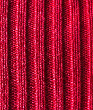 Arka fon olarak kırmızı örülmüş doku. Yakından çekilmiş, el örgüsü, canlı kırmızı. Grafik duvar kağıdı için desenli arkaplan kavramı. Sapı kopyala