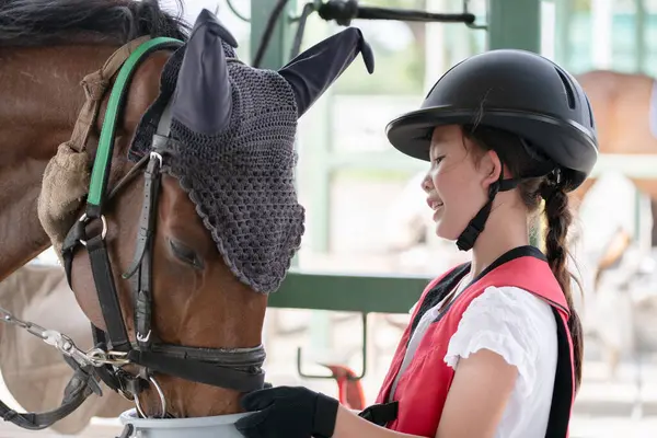 stock image little asian girl  with  horse