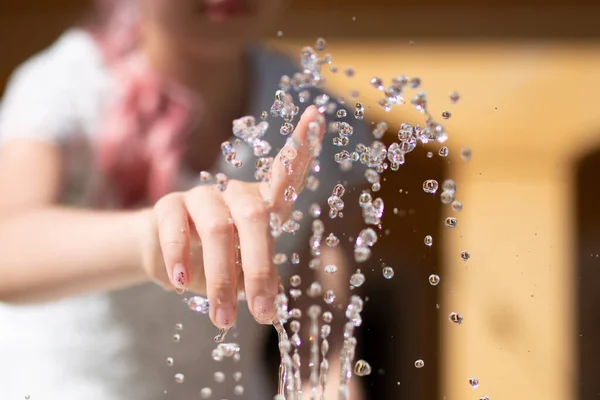 Girl Hand Touching Water Fountain Stock Picture