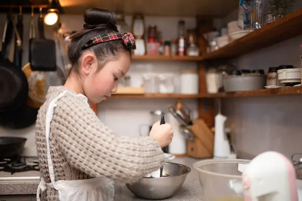 Girl making sweets at home