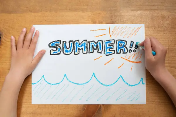 girl  drawing summer on paper sheet