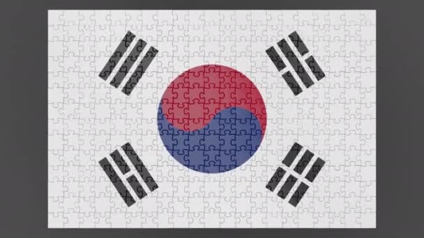 Animacja Flagi Korei Południowej Spadającej Powierzchnię Złożonej Układanki Kanałem Alfa — Wideo stockowe