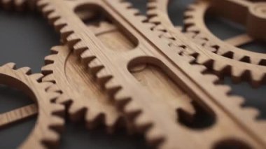 Ahşap vites askısı kullanan bir grup ahşap dişlinin animasyonu. Döngülü hareket. Yakın plan. Odaklanmayın