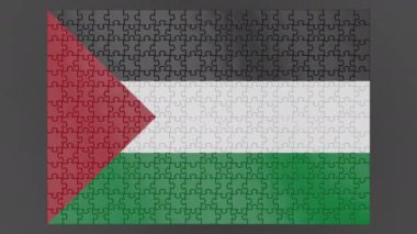Yüzeye düşen bir Filistin bayrağının animasyonu alfa kanalı ve gölgesi olan bir bulmacadan toplandı. Rüzgar, dağınık parçaları çerçeveden dışarı savurur.